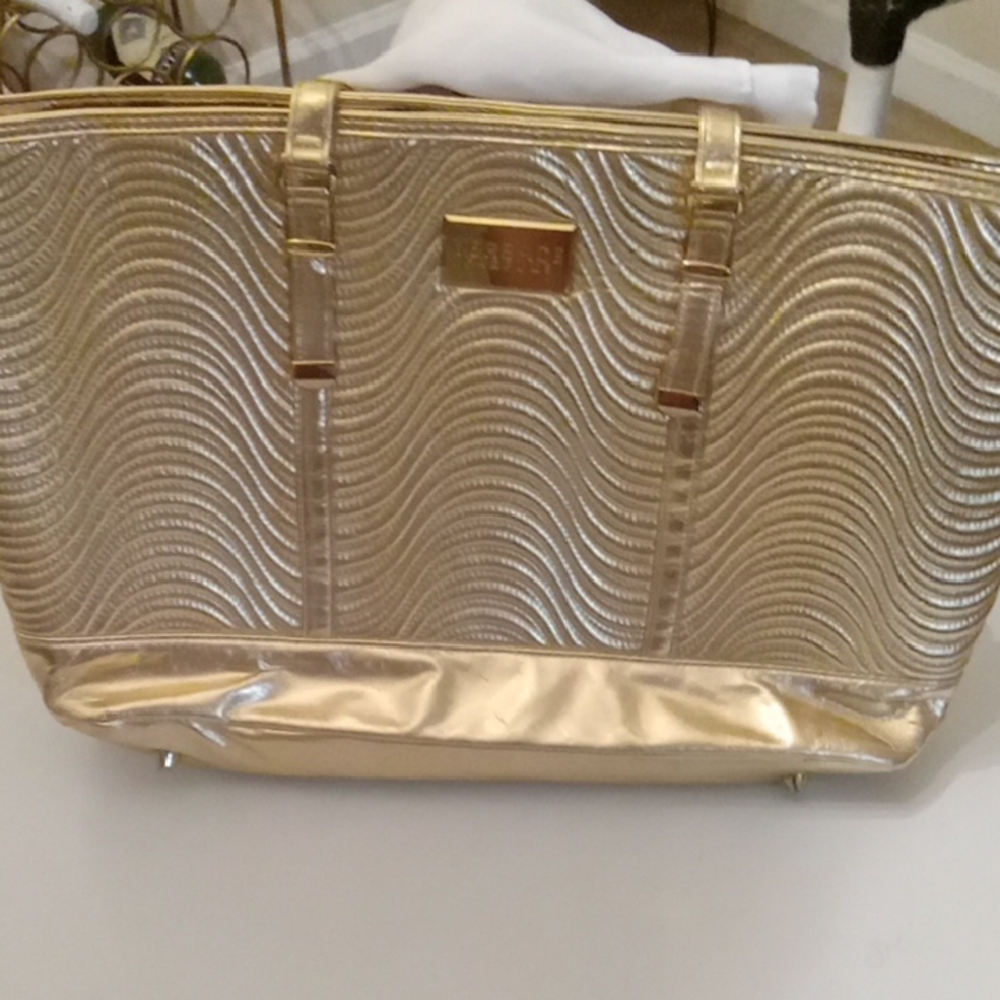Gold Versace Parfume Bag very big Inside with Feet on the bottom.